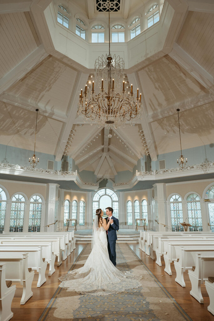 Bride and Groom standing insde Disney Wedding Pavilion