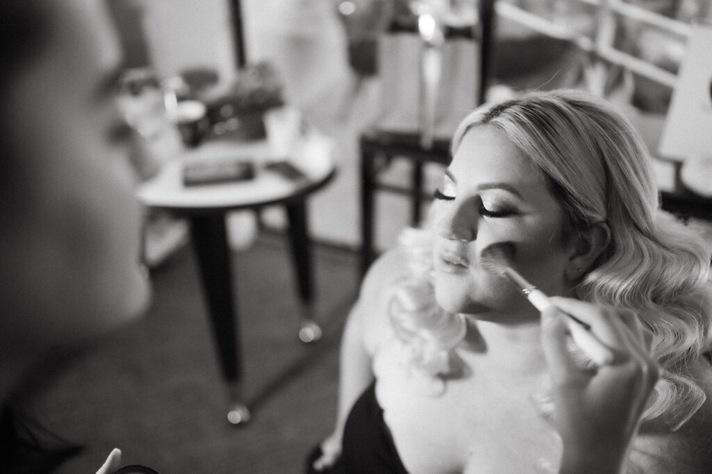 Bride getting makeup applied